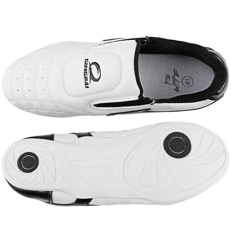 Black and white children's boxing shoes with soft bottom construction for martial arts training