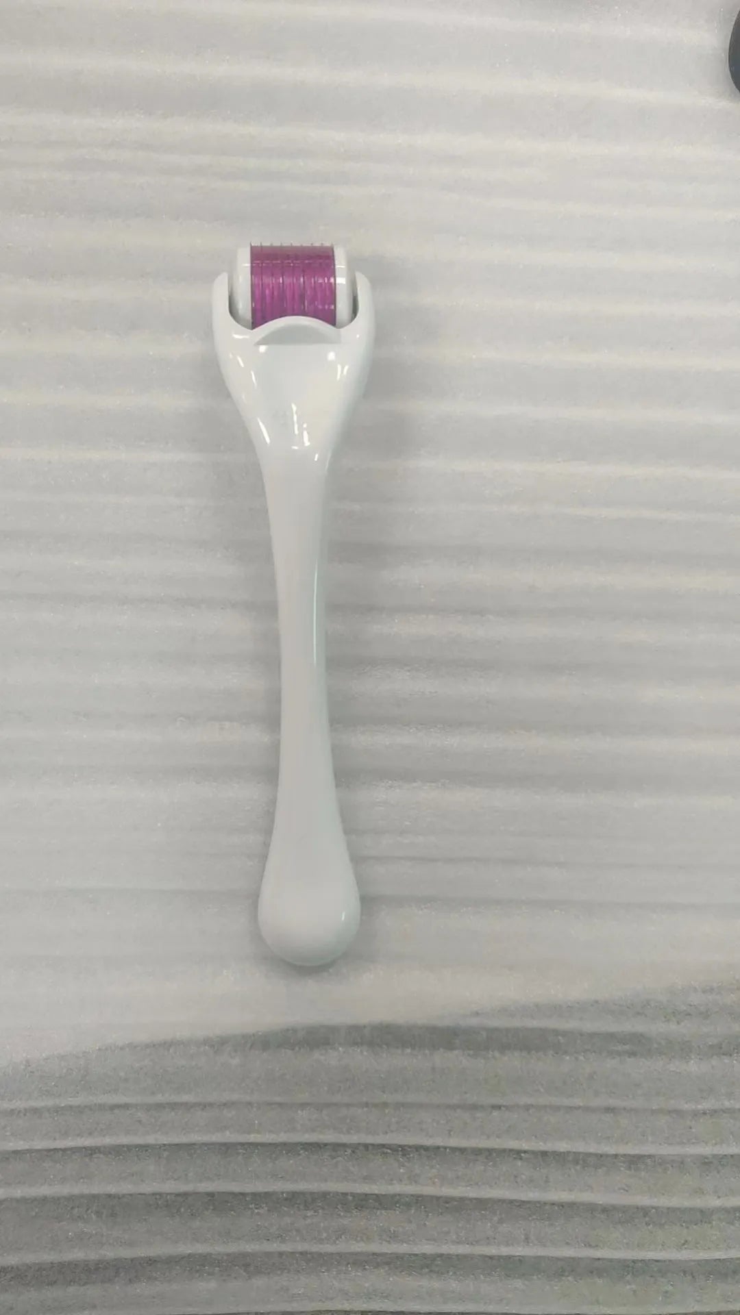 540 micro needle derma roller showing handle and wheel in different colour combinations with size specifications