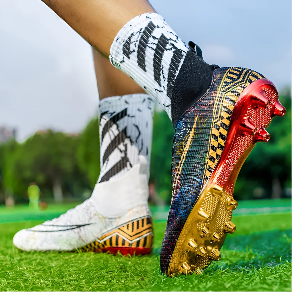 High-top male football training shoes with gold plated sole in black, white and mandarin duck colours