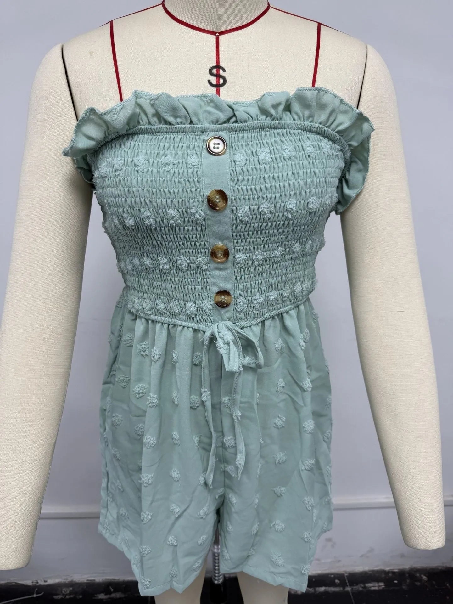 Women's solid colour off-shoulder sleeveless jumpsuit in blue showing Japanese Korean casual style with button detail
