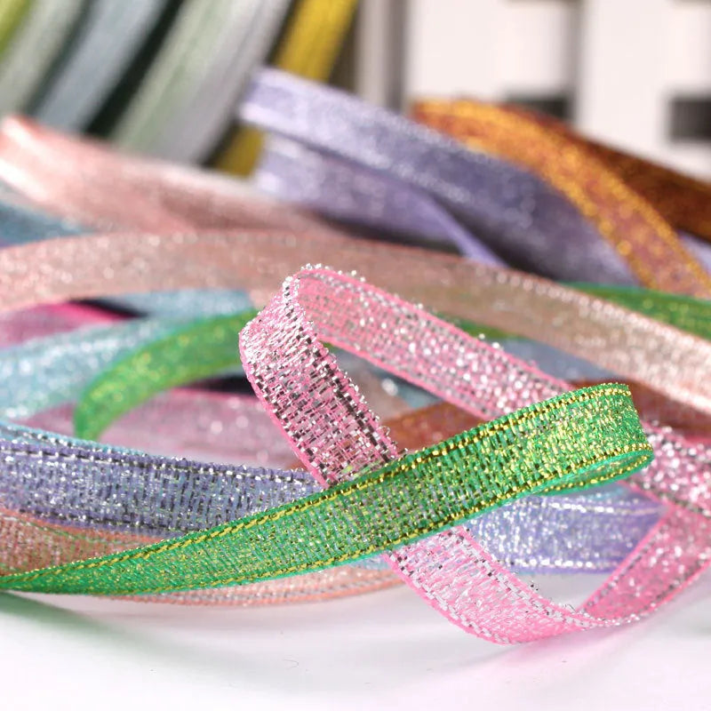 Roll of narrow 0.6cm wide polyester gift wrapping ribbon in assorted colours, showing 22 metre length.