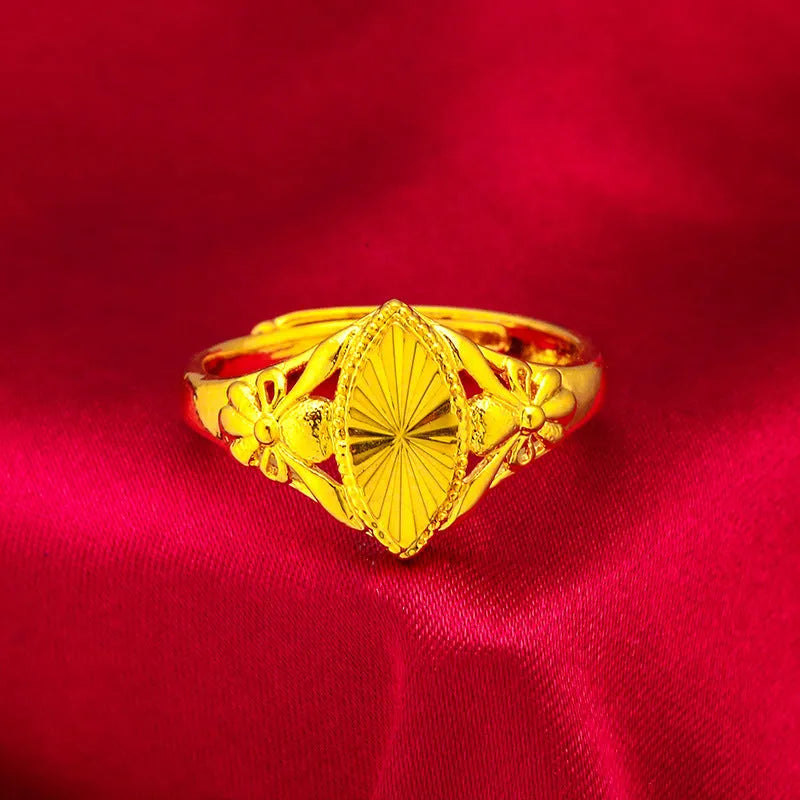 Gold electroplated brass flower ring with open geometric design and textured alluvial pattern