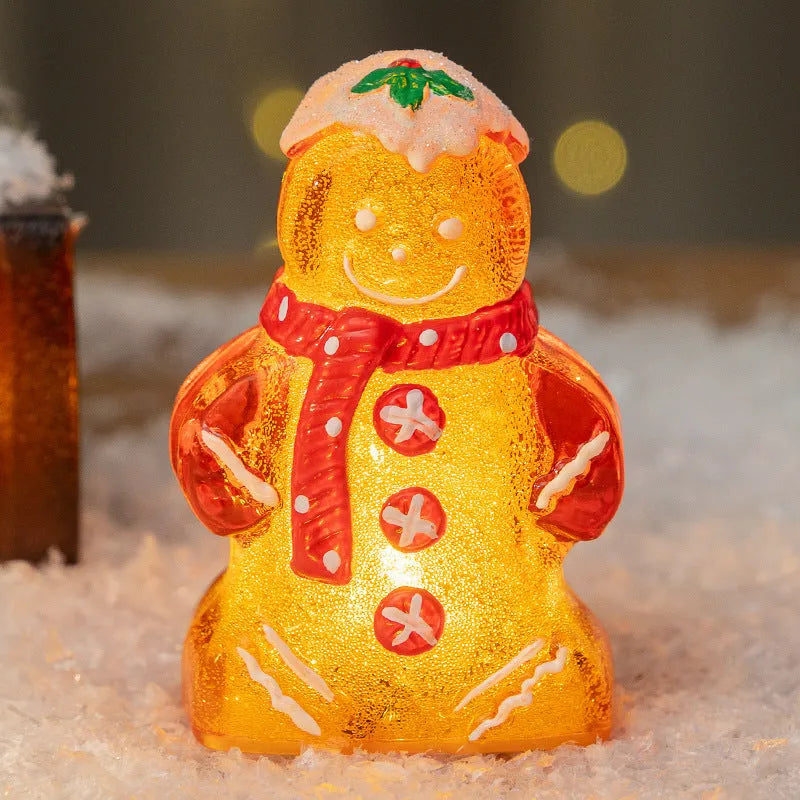 Glowing plastic gingerbread man Christmas ornament with a scarf in red, white, or transparent colours.