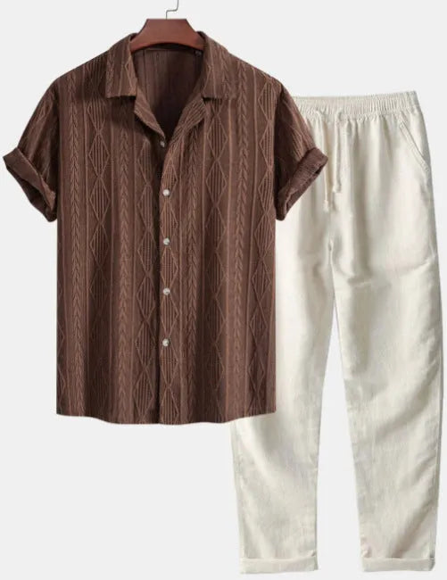 Men's camouflage print casual suit set with short-sleeve lapel shirt and trousers on a hanger.