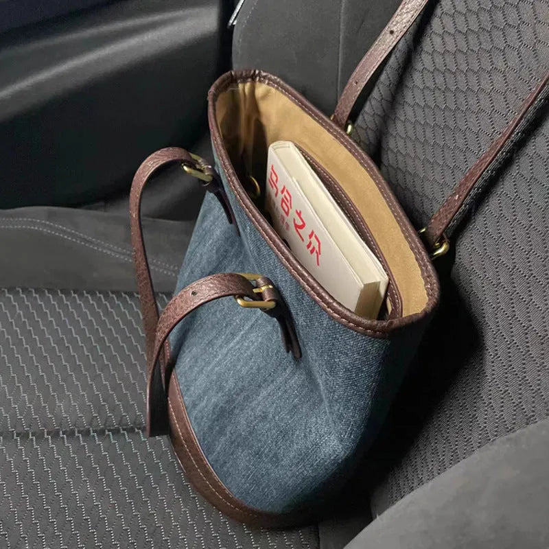 Denim patchwork one-shoulder bucket handbag with polyester construction measuring 23cm by 27cm by 16cm