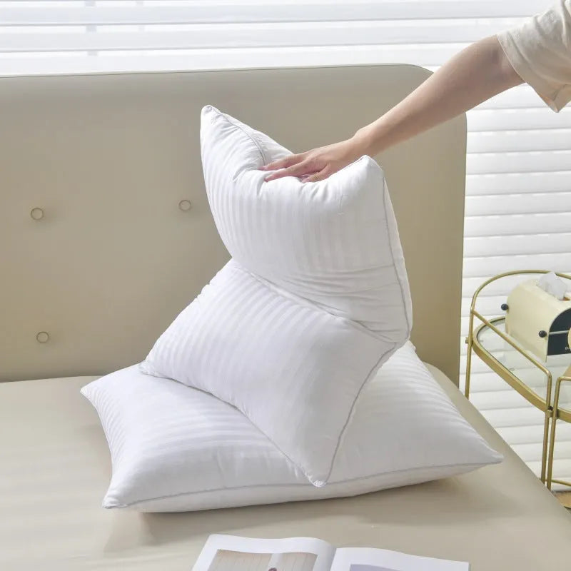 White cotton satin stripe pillow with feather cotton fill showing three size options