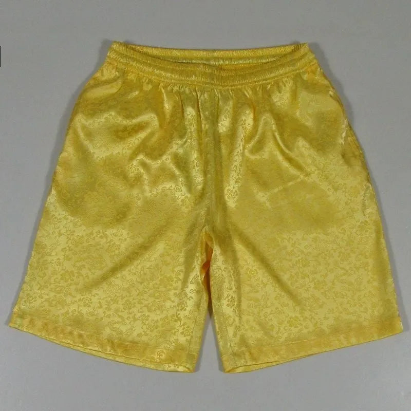 Men's black Tang suit style shorts with a loose fit and elasticated drawstring waistband.