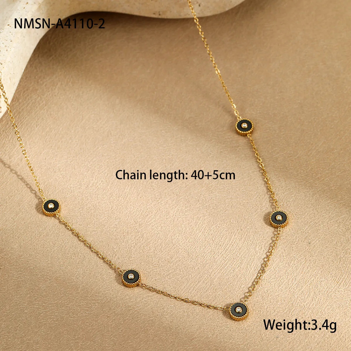 Geometric fritillary pattern stainless steel bracelet with 18K gold plating and matching necklace