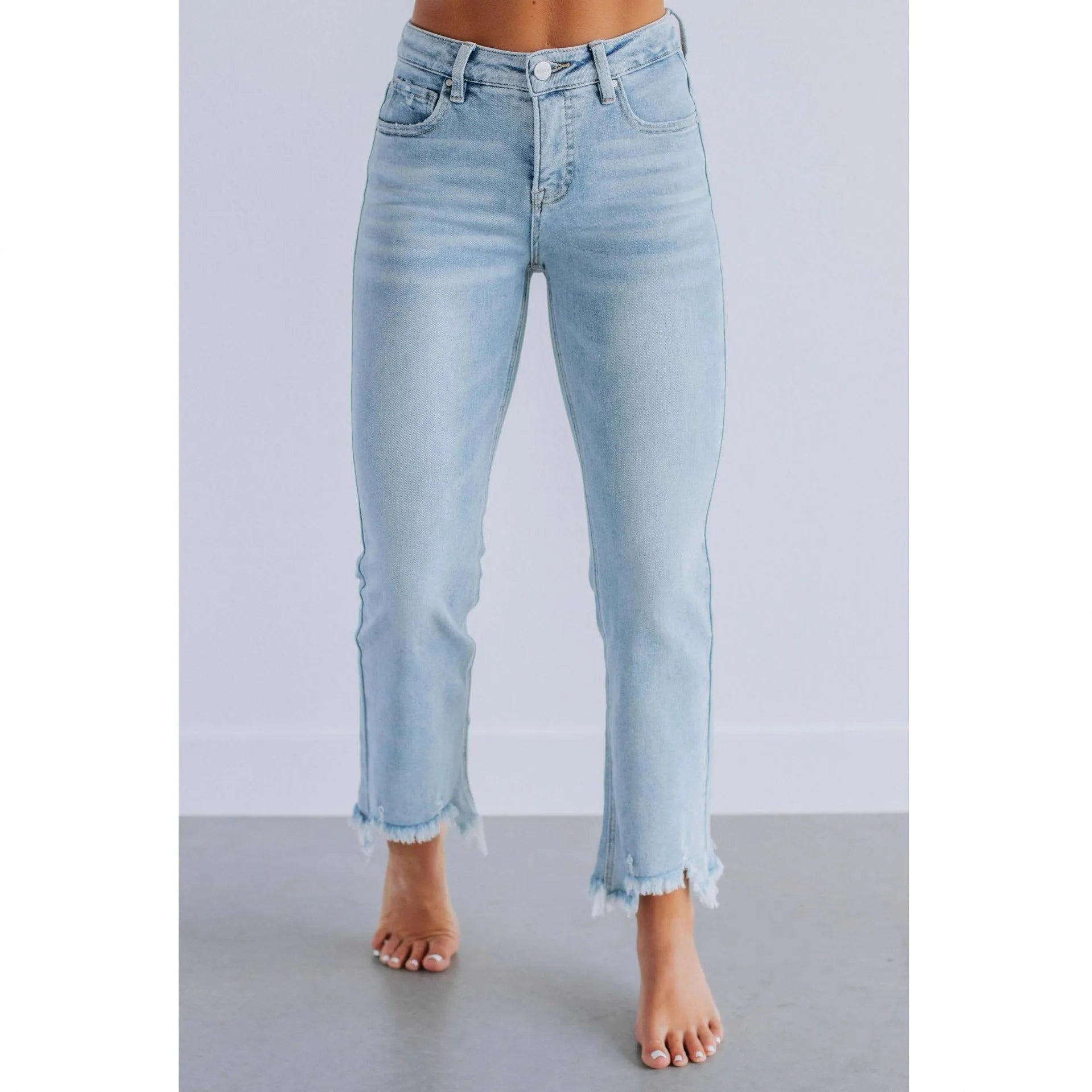 Solid colour women's denim jeans in dark blue and light blue washes, showing hand-worn detail.