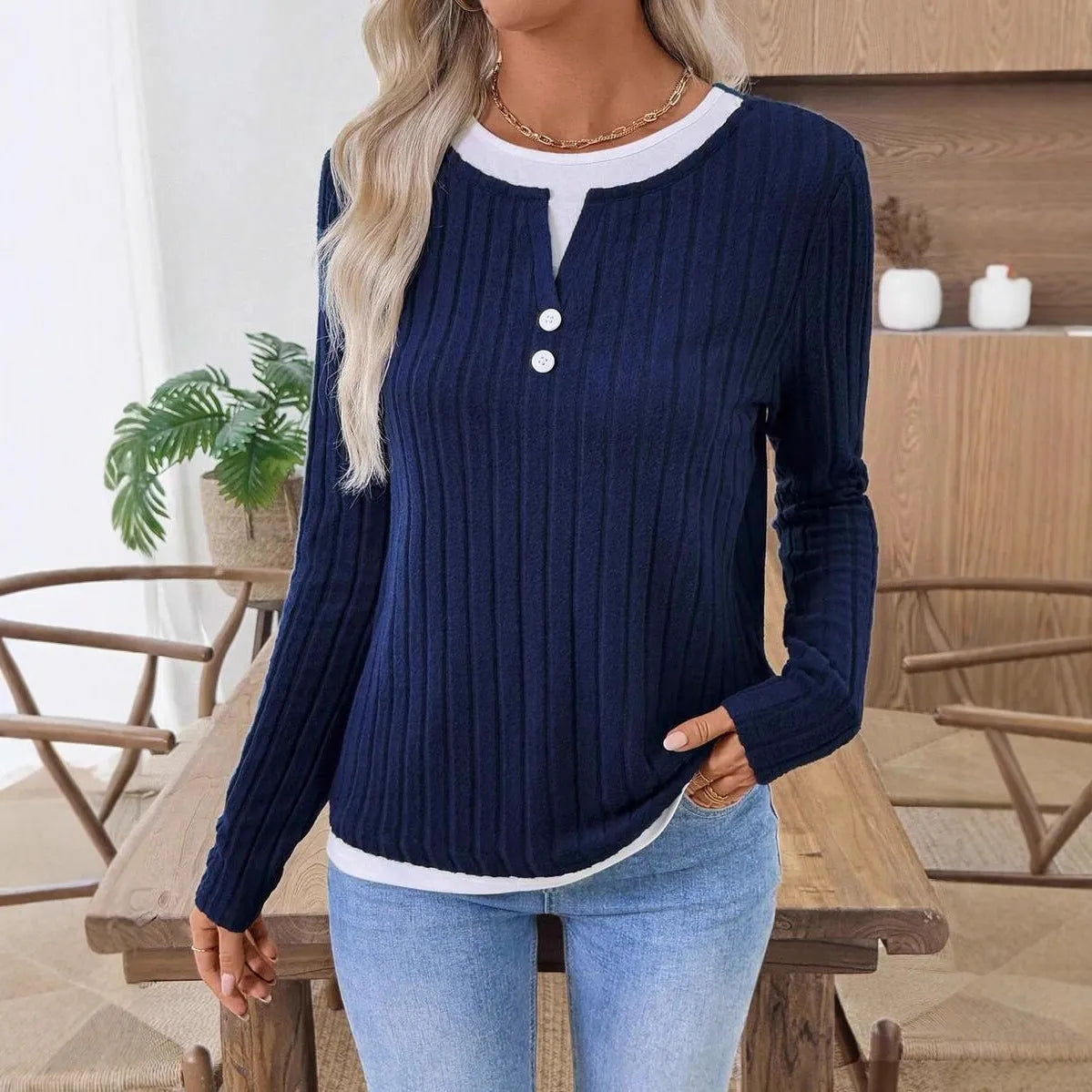 Women's grey fake two-piece striped pullover sweater with round neck and button detail.