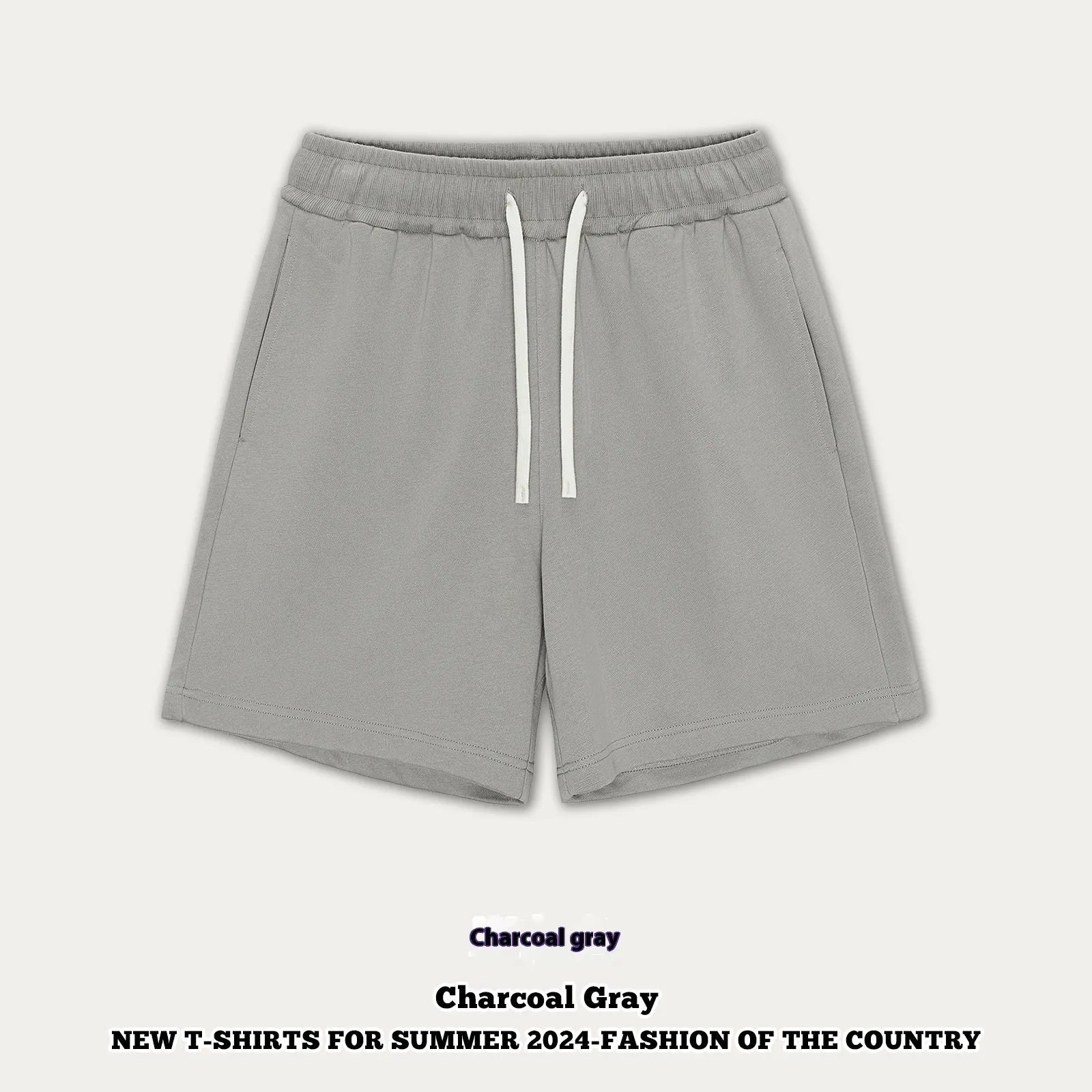 Loose fit cotton denim baby shorts in charcoal grey on a hanger