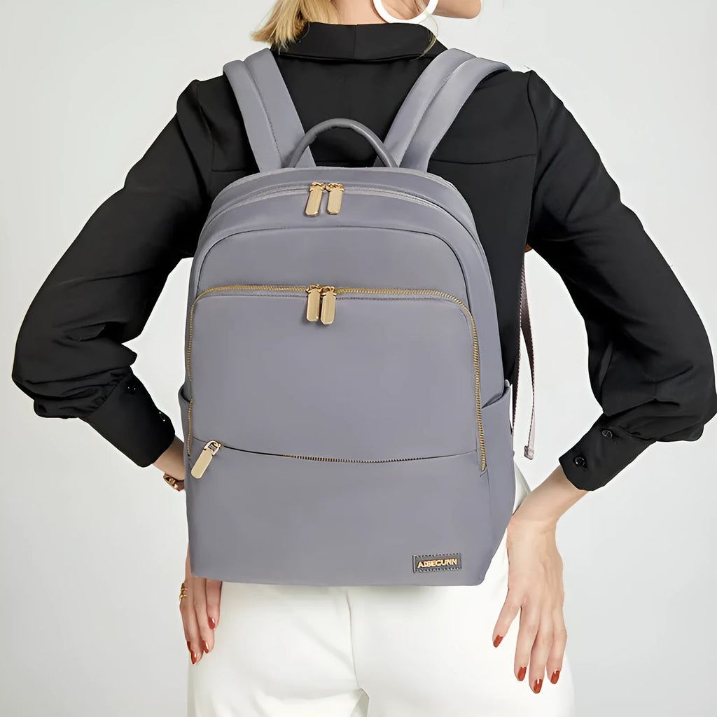 Large capacity women's Oxford cloth backpack in black and grey colours showing waterproof anti-theft design