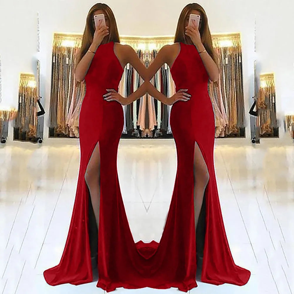 Long red evening dress with a high waist, large swing skirt, hollow detail, and a hanging neckline.