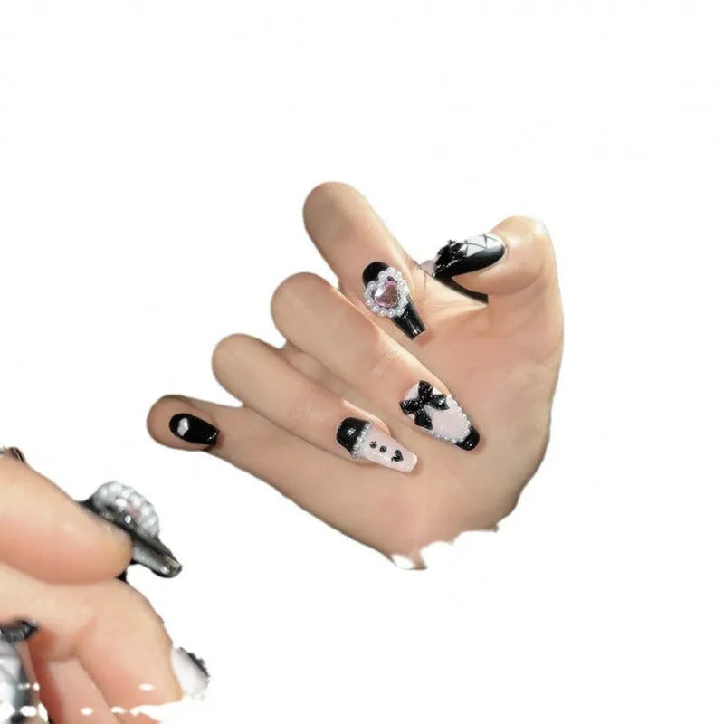 Black peach heart hand-painted cat's eye nail art set with bow patterns on plastic nails