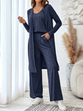 Blue women's three-piece suit set with sling top, long cardigan and trousers on hanger