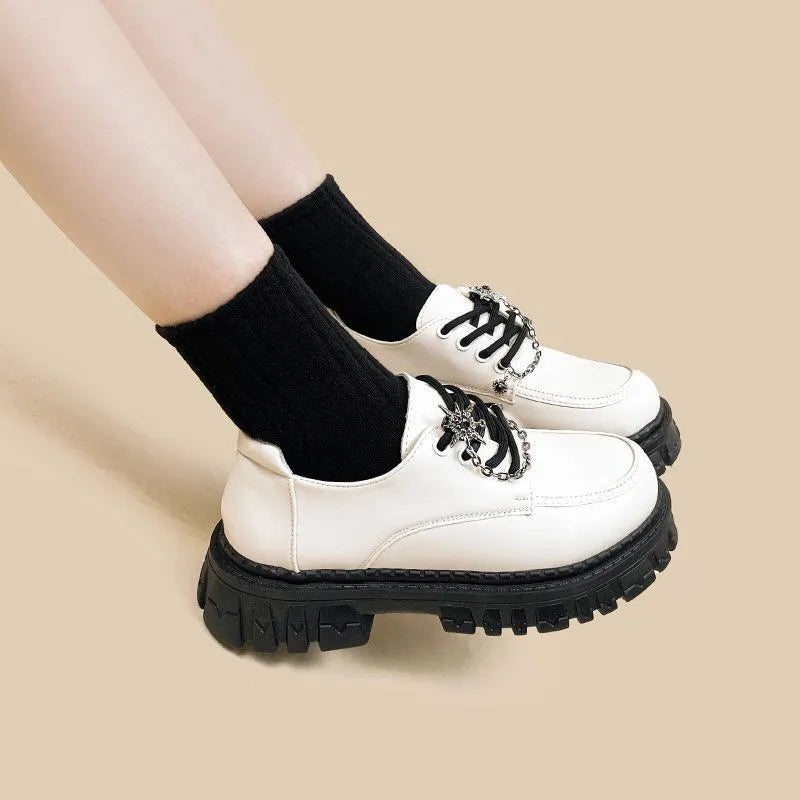 Women's Duke Asterism colour loafers with a round toe and metallic cross strap fastening.