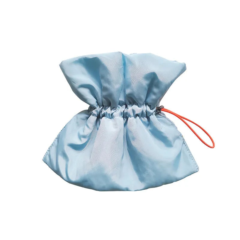 Soft blue adjustable Elizabethan recovery collar for a cat on a plain background.