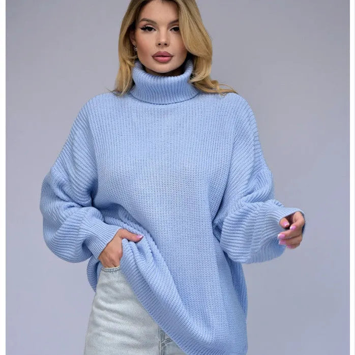 Women's solid colour high neck loose fit pullover sweater on a hanger