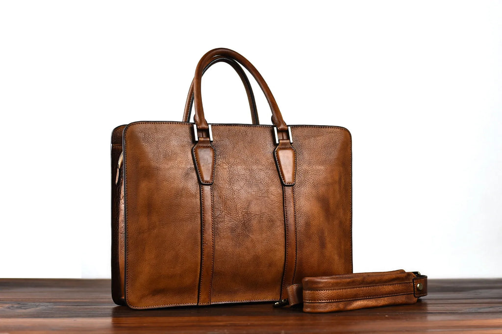 Men's brown leather retro horizontal business handbag with zipper opening.