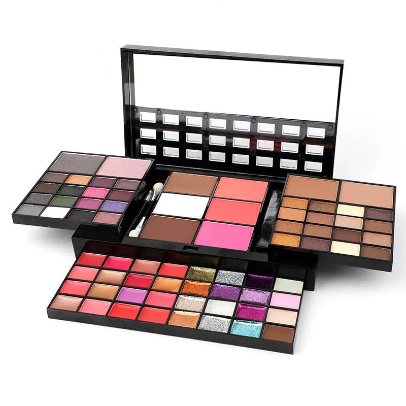 74 colour makeup palette open showing eyeshadows, lip glosses, concealers, blushes, and contour powders with included brushes