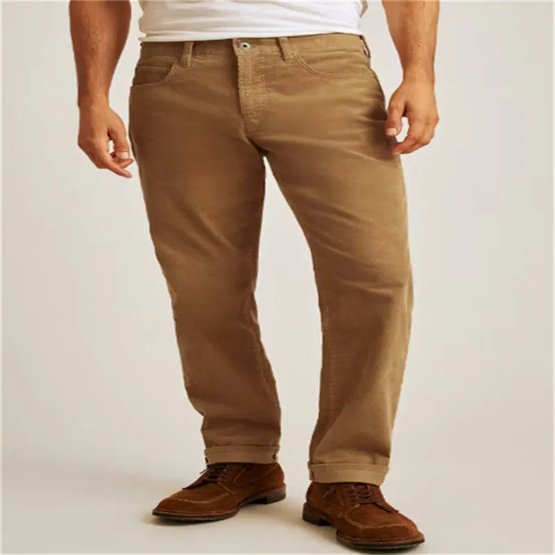 Men's corduroy straight leg trousers in army green showing mid waist and zip fly detail
