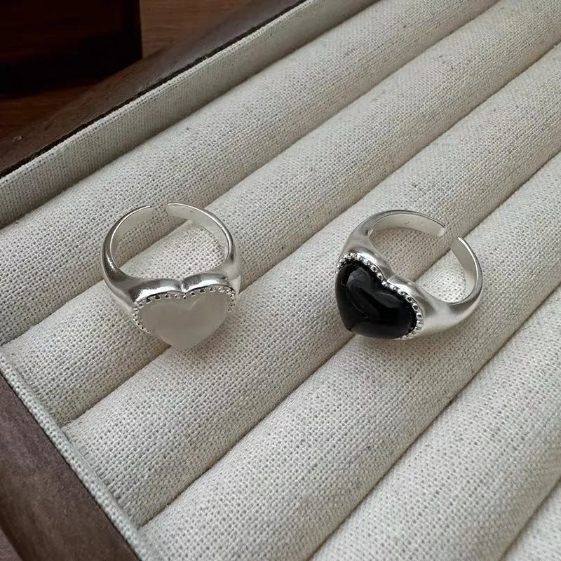 Adjustable open-mouth sterling silver ring with a black heart-shaped agate stone.