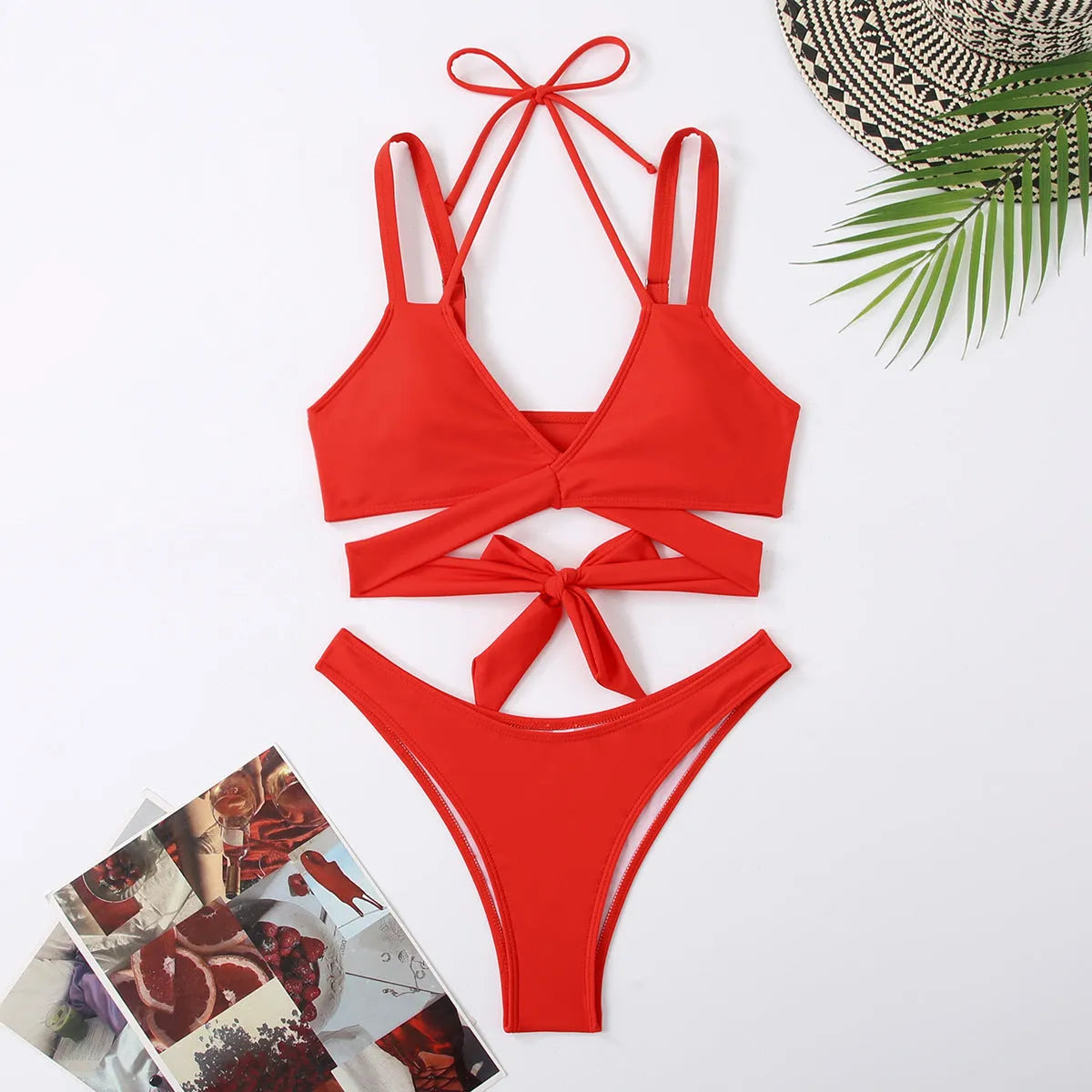 Women's solid colour bikini swimsuit on a hanger, showing adjustable straps and briefs style.