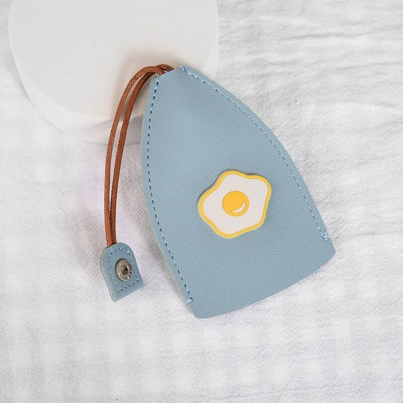 Cartoon design pull-out car key case made from soft PU leather, showing approximate size.