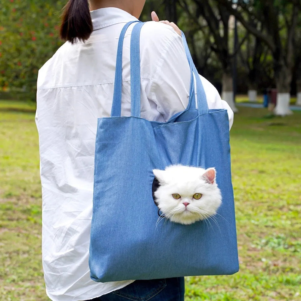 Soft canvas pet shoulder bag with cartoon pattern, shown in Light Denim colour for carrying small dogs or cats.