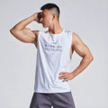 Man wearing a lightweight grey mesh sports vest with a loose fit and straight hem.