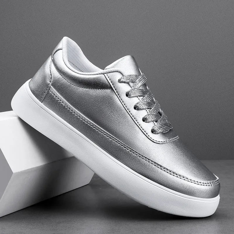 Women's white leather flat casual shoes with front lace-up closure.