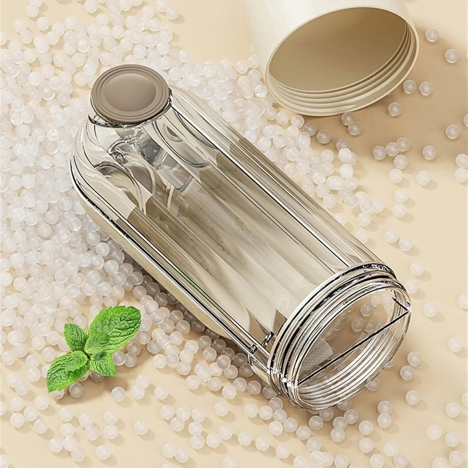 Beige foldable dog water bottle with a press-button dispenser and a small food container at the base.