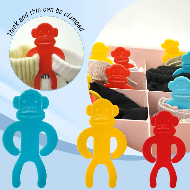 Plastic socks storage clip in blue, red, and yellow colours for machine washing.