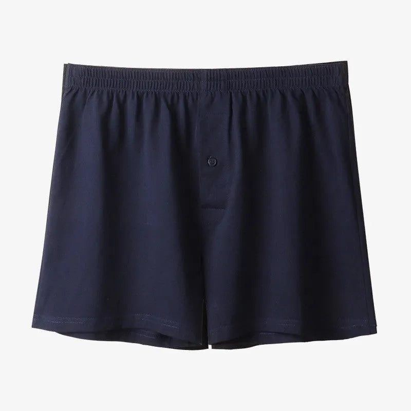 Men's high-waisted loose-fit cotton boxer shorts in black, grey, and navy blue.