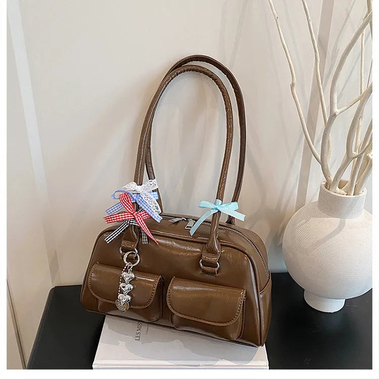Women's retro pillow-shaped PU leather shoulder bag with flap closure and double straps