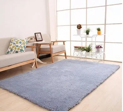 White plush rectangular area rug with a dotted non-slip bottom, shown at 40cm x 40cm size.