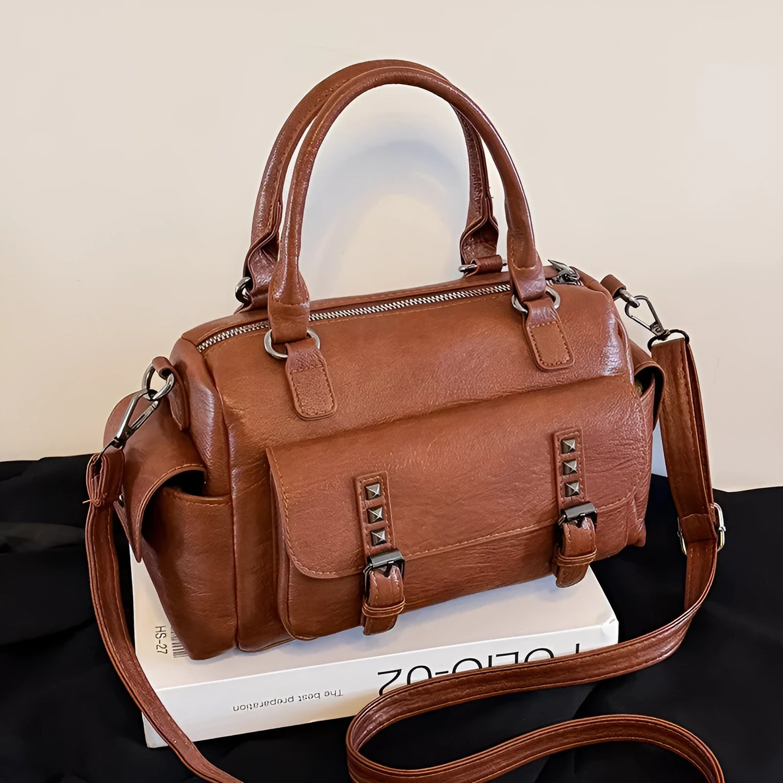 Vintage-style large messenger bag in PU leather, showing horizontal square shape and contrast stitching.