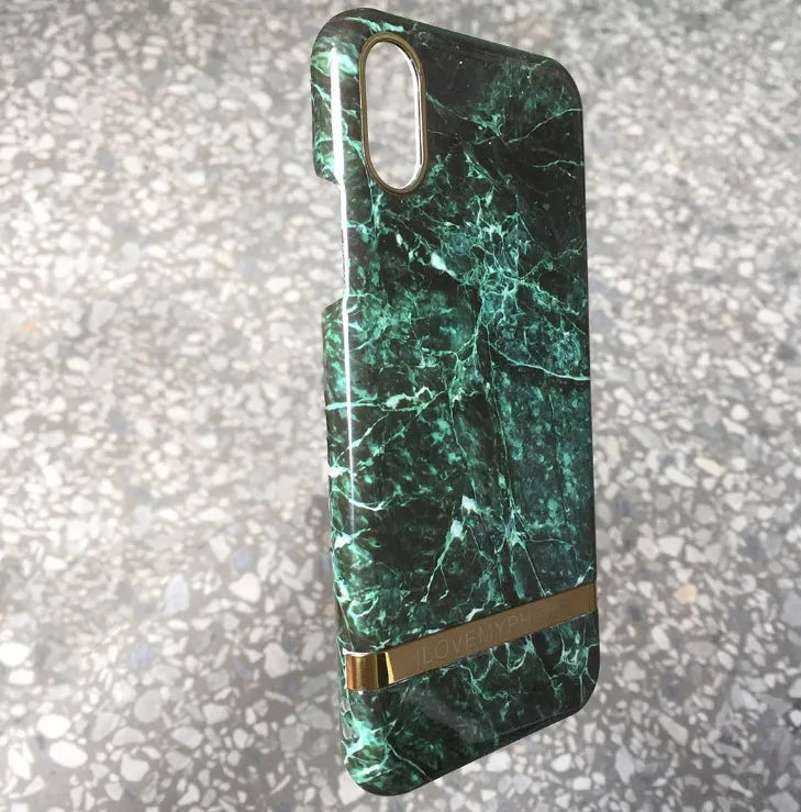 Marble pattern plastic case for iPhone on a table, shown in multiple colour options.