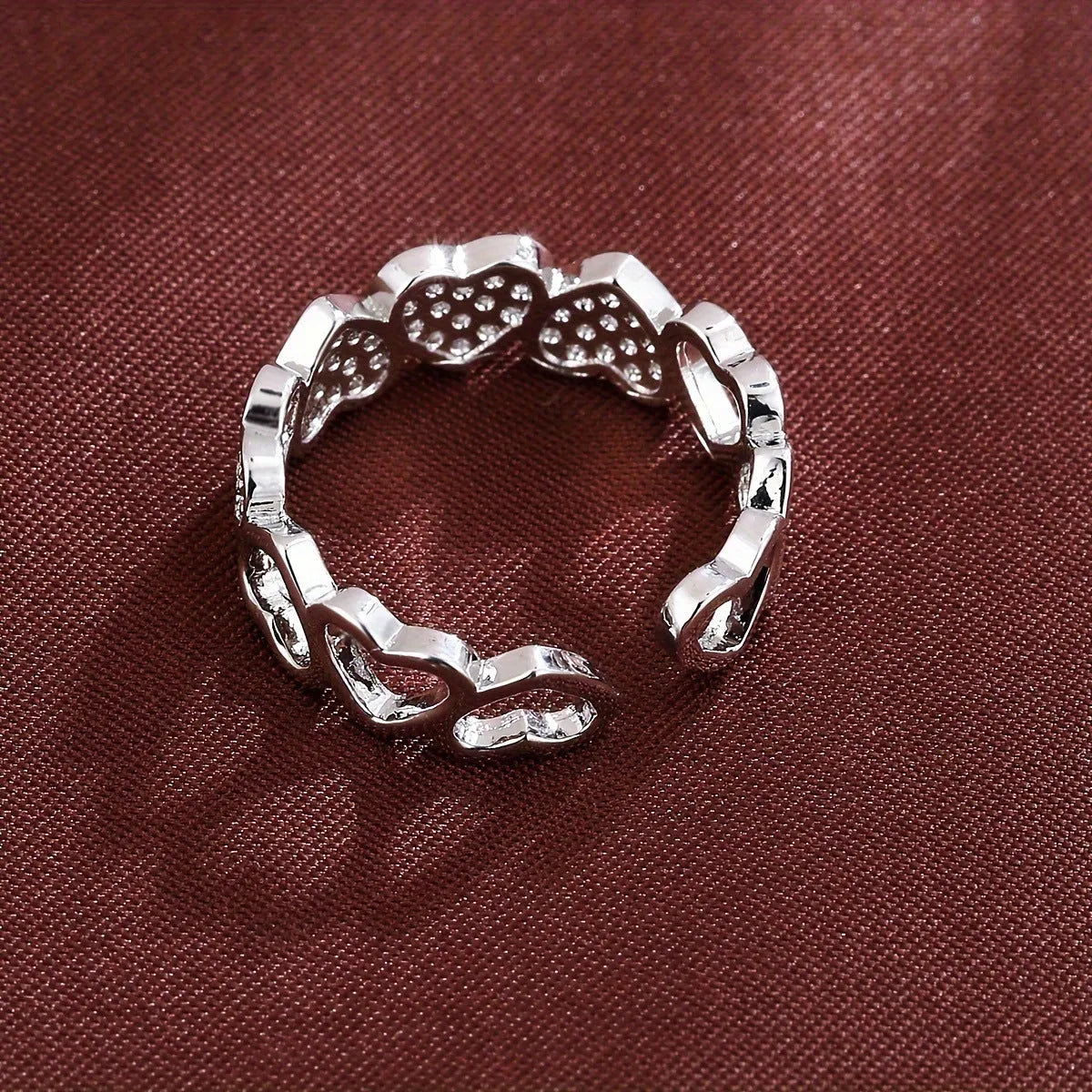 Adjustable open-ended copper couple's ring with geometric shape and heart detailing in gold or silver finish