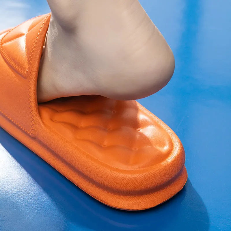 A pair of thick-soled EVA bathroom slippers in a selected colour, showing the non-slip sole pattern.