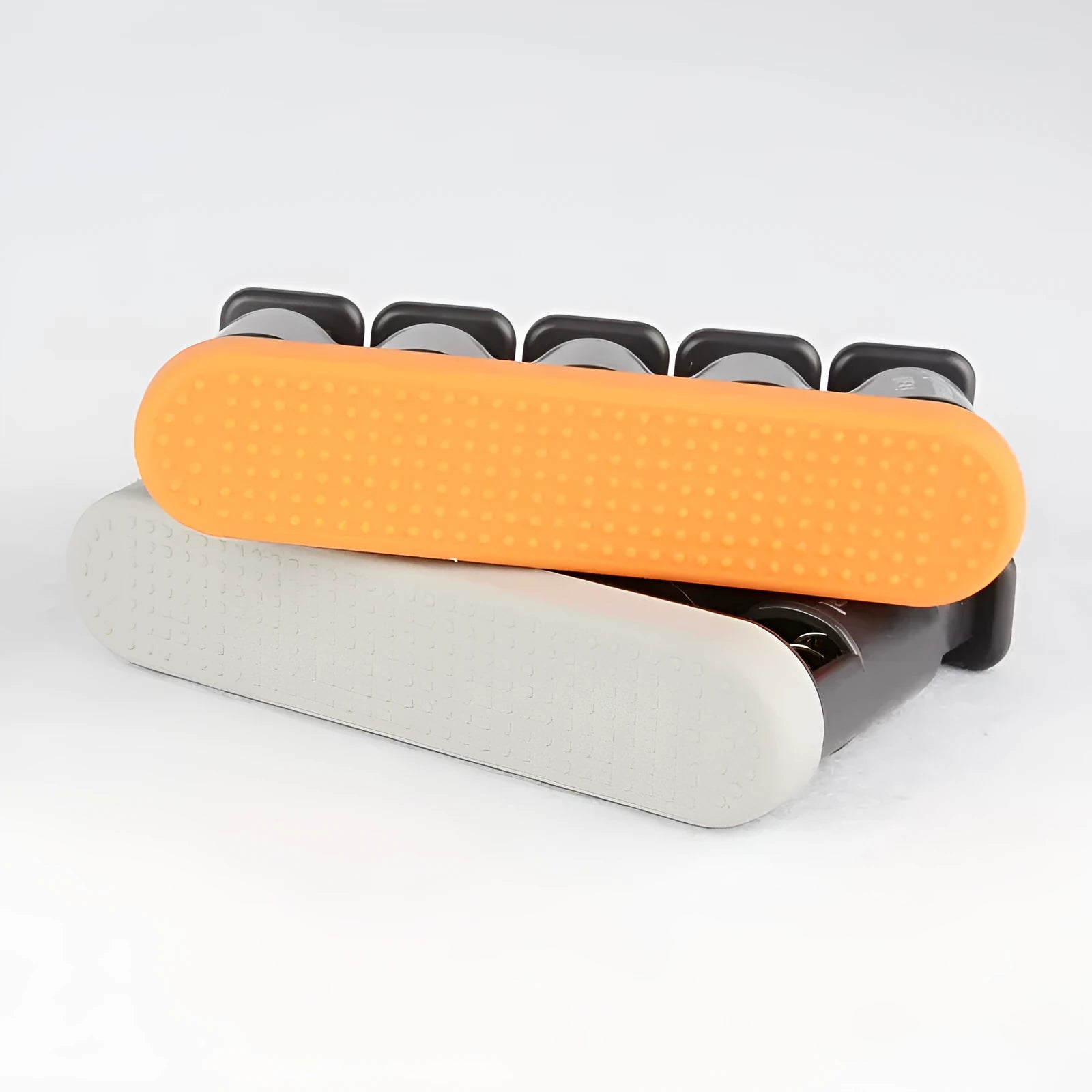 Non-slip silicone finger trainer in grey or orange colour for hand muscle development