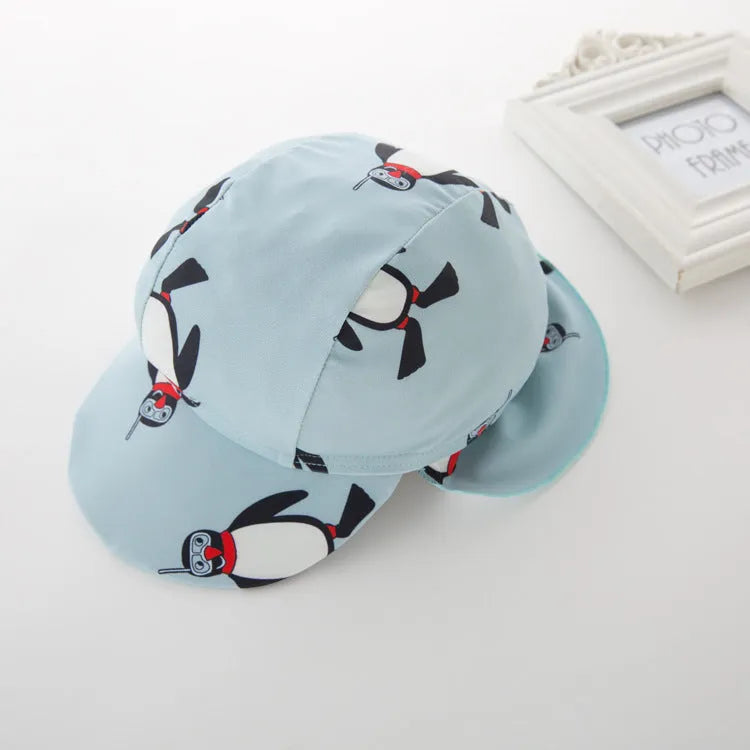 Boys' penguin print long-sleeve one-piece swimsuit with matching swimming cap