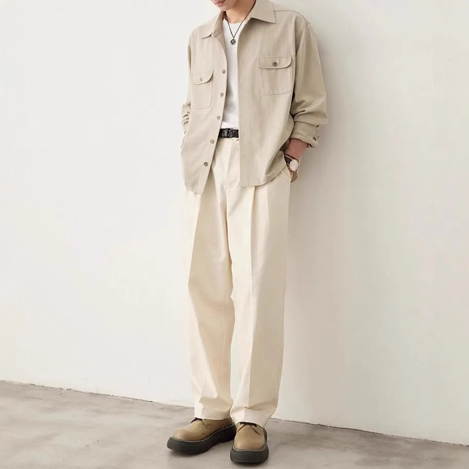 Men's simple lapel long sleeve shirt in light sand rice colour, cotton blend fabric, laid flat.