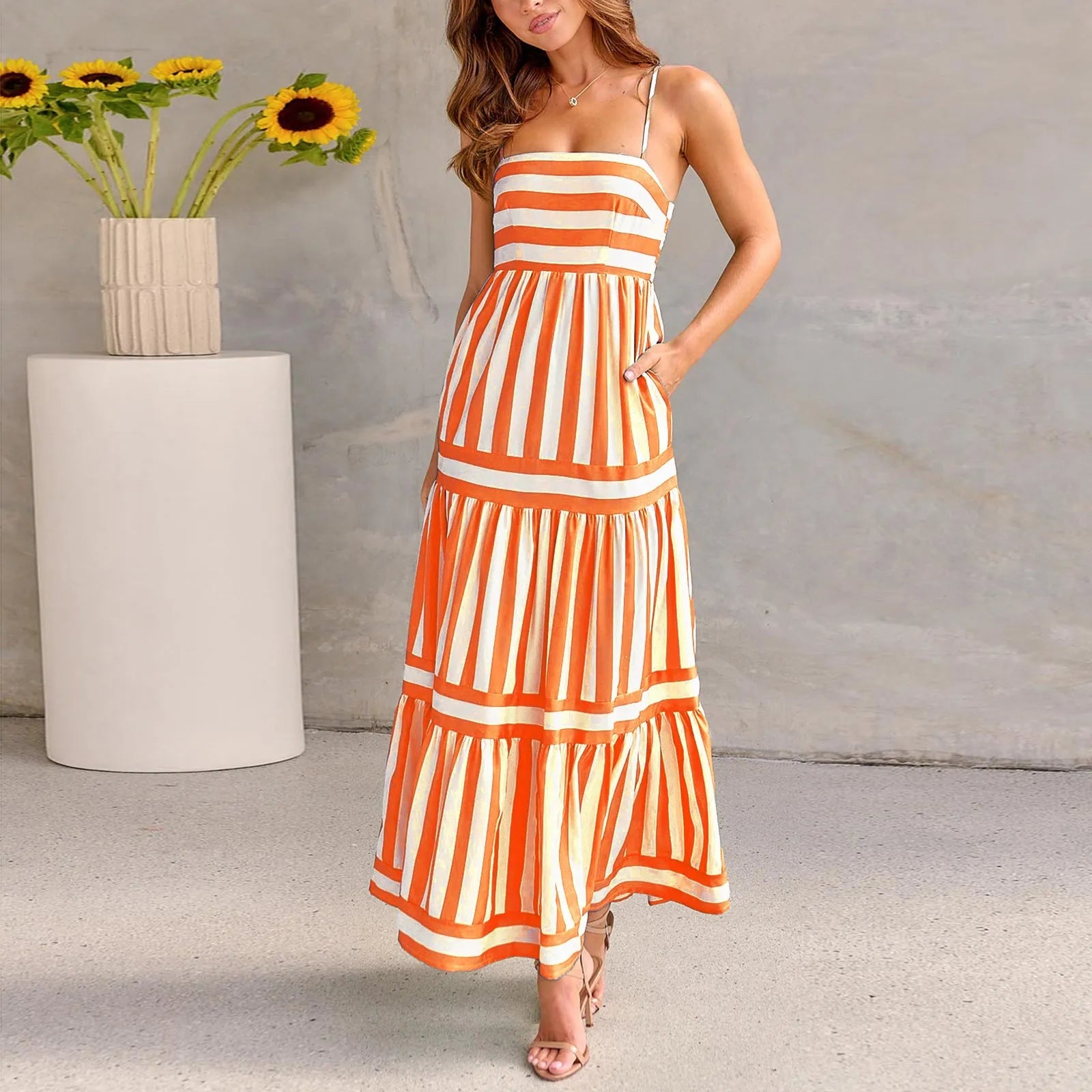 Women's striped long summer dress with suspenders, a square neck, backless design, and side pockets.