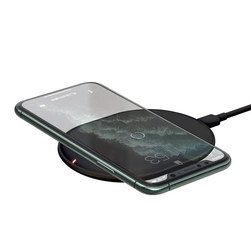 Baseus black wireless charging pad with phone positioned on charging surface