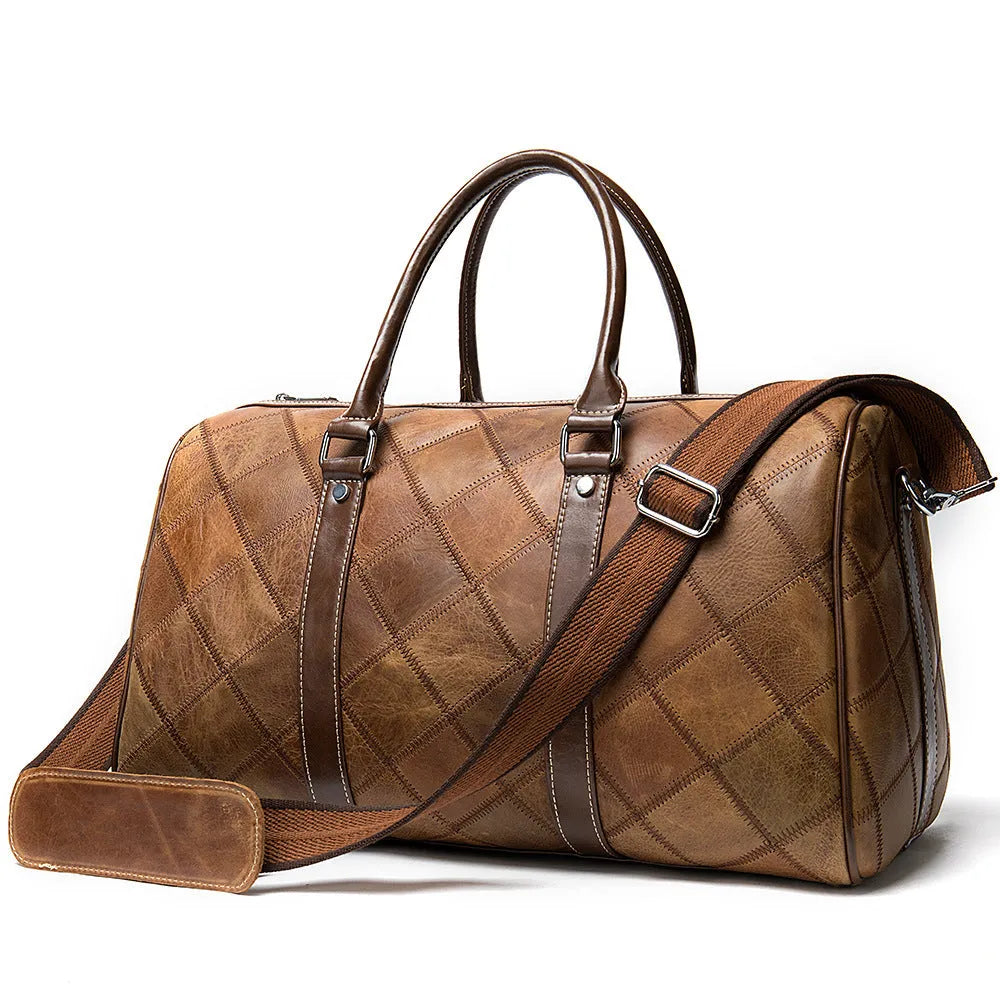 Vintage brown cowhide leather men's duffel bag with a single strap, shown open to reveal internal phone and ID pockets.