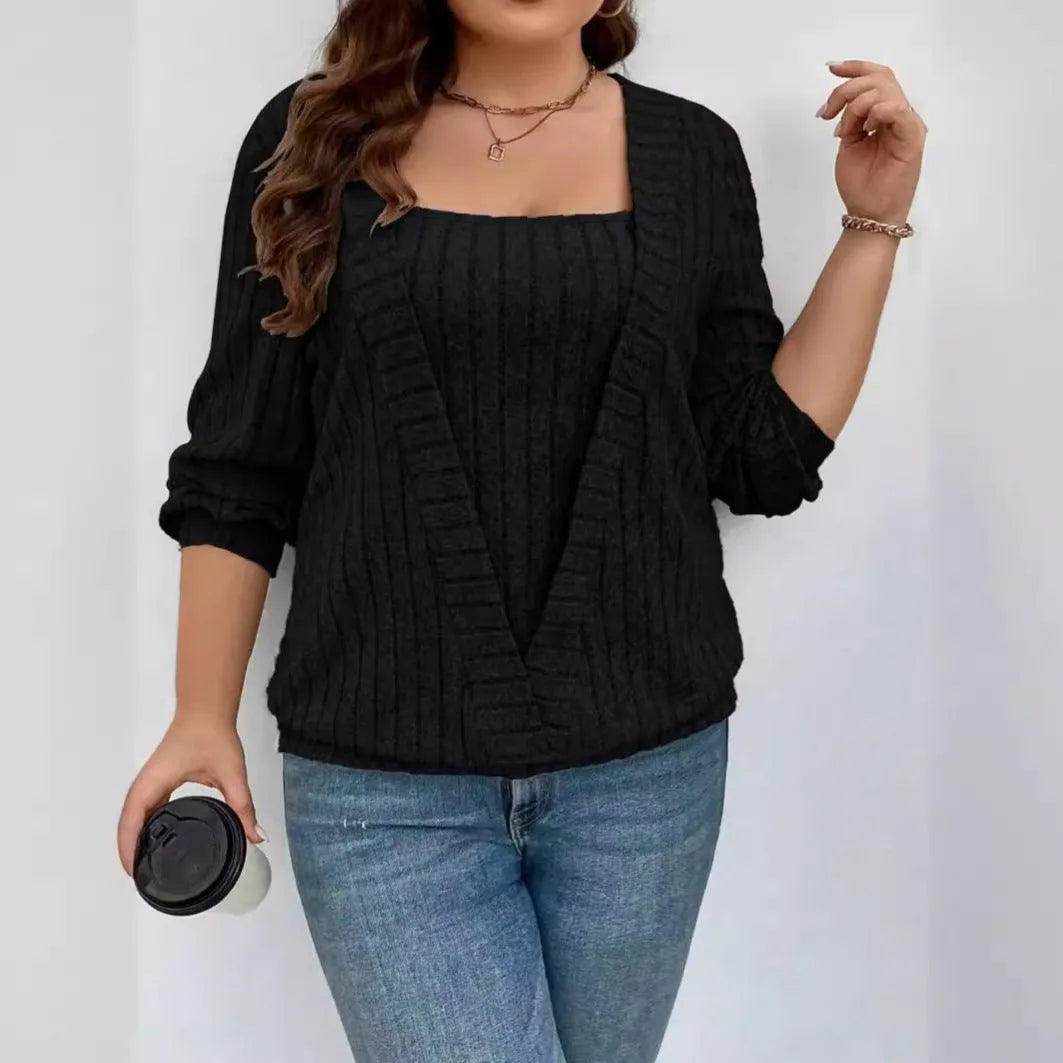 Women's solid colour ribbed V-neck false two-piece suit top with long sleeves on a hanger.