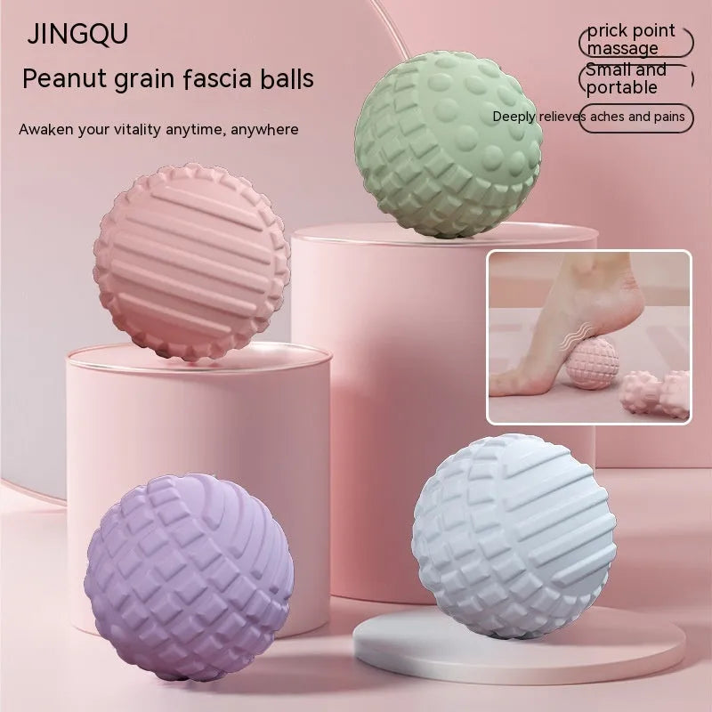 Blue peanut-shaped TPR foot massage ball on a wooden floor.
