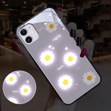 Luminous iPhone case with voice-activated colour light showing painted daisy and broken flower design on TPU protective shell
