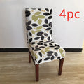 A stretchy spandex chair cover fitted neatly on a four-legged wooden dining chair.